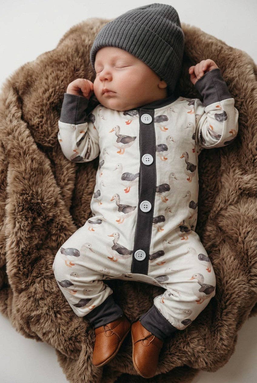 Gray Duck printed baby romper with snaps.
